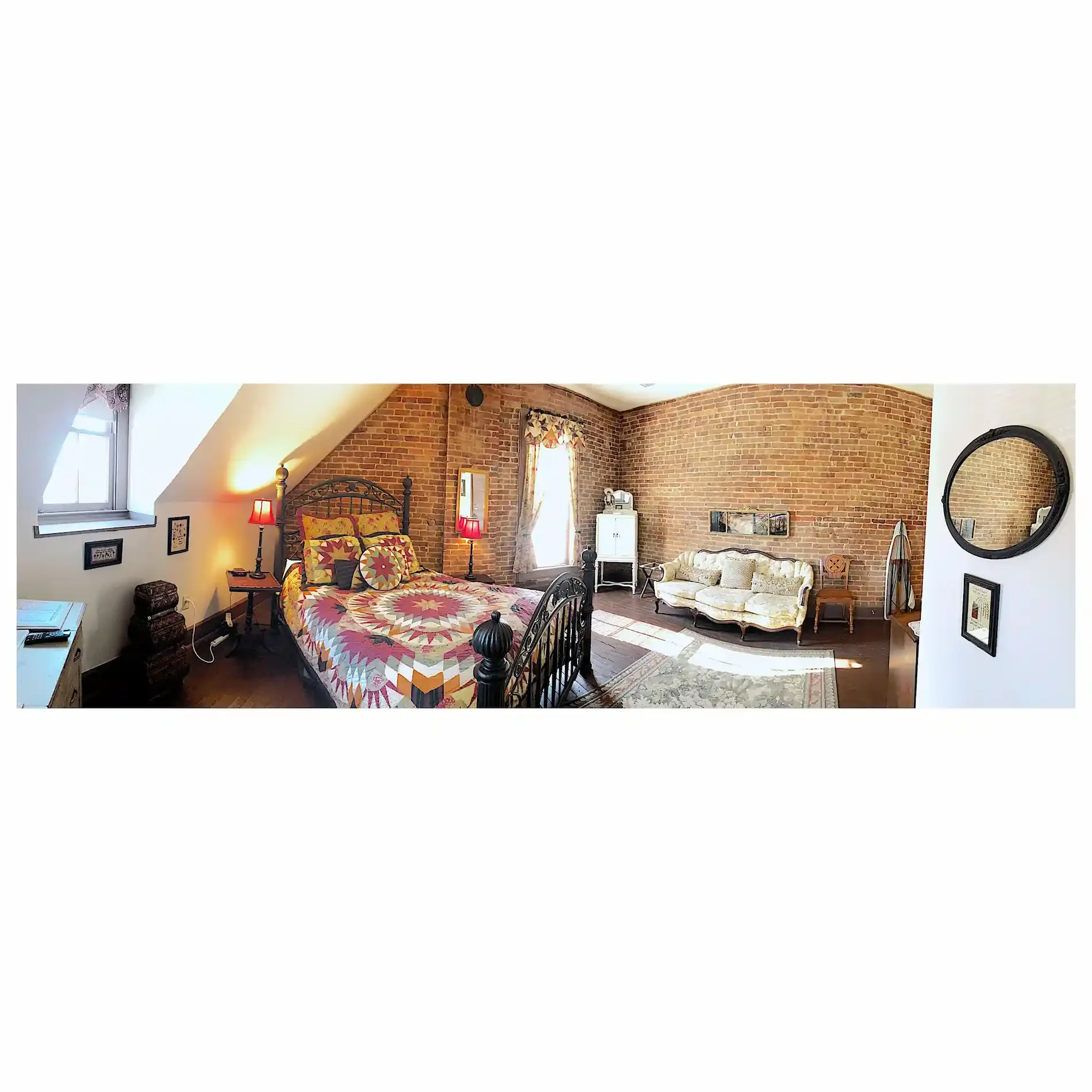 Spacious attic bedroom with exposed wooden beams